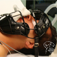 Patient spine surgery lying face up protecting his face with baseball Catcher.